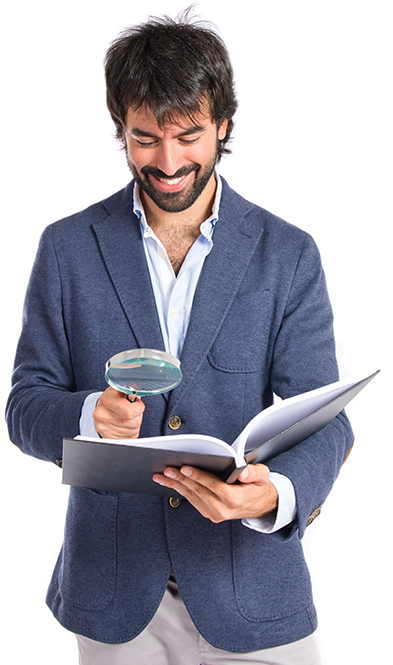 A person holding a magnifying glass and a book